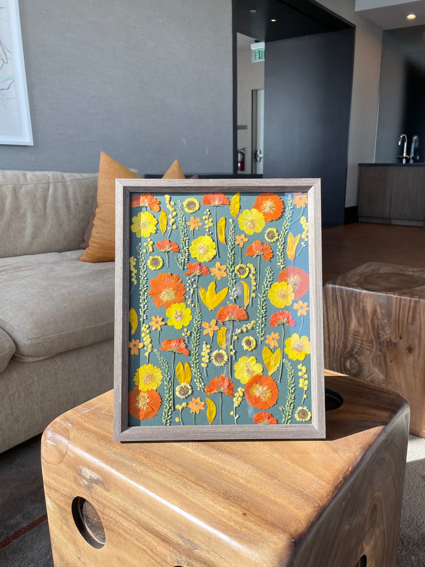 Press flower arrangements made using yellow and orange daisy flowers and sunflowers. It's a custom frame gift made by an artist based in San Francisco and Bay Area.