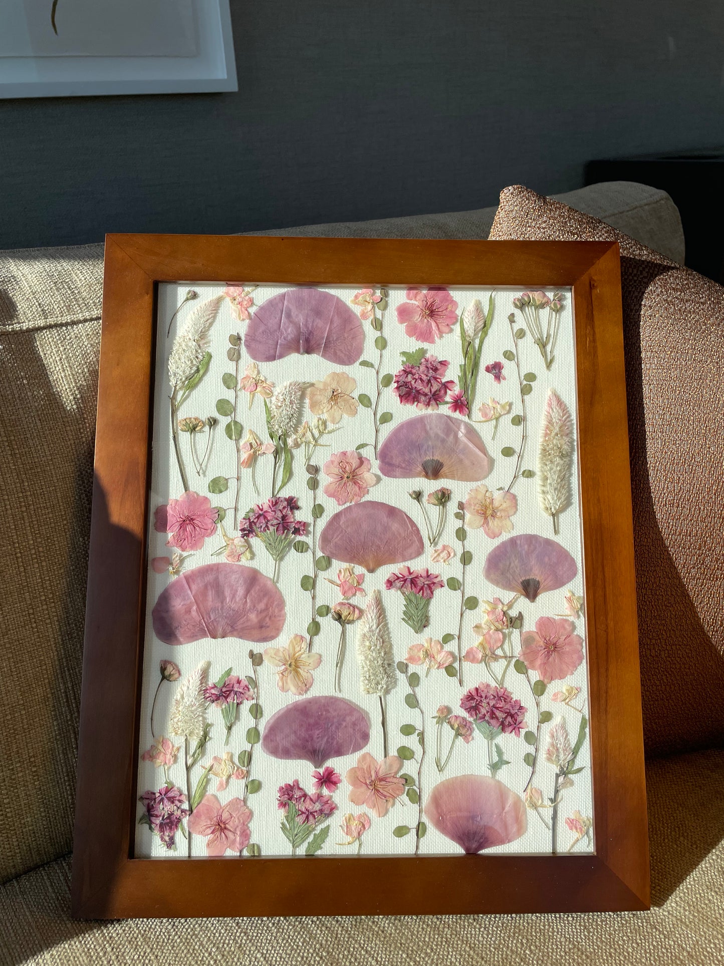 handmade floral art made using pink poppy flowers and other pink pressed flowers. A handmade gift made by San Francisco artist PlantBox.